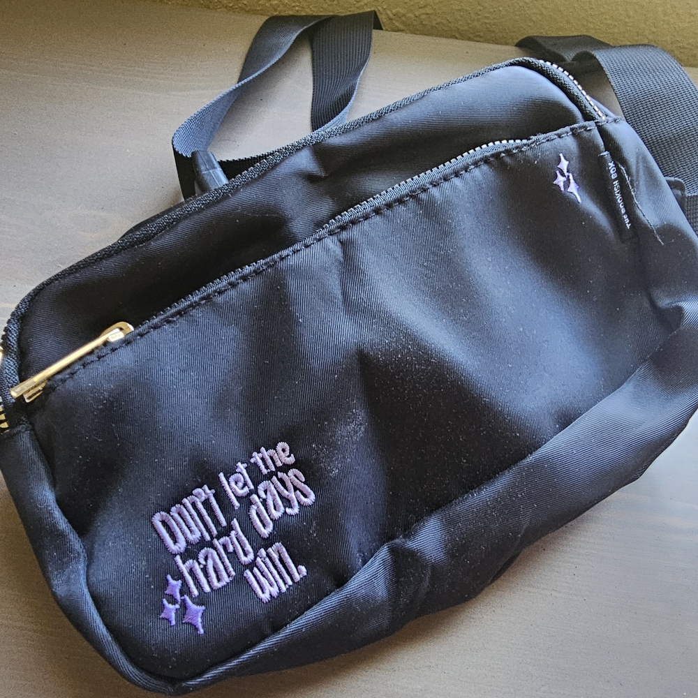 Stylish Black Crossbody Bag with Purple Accents